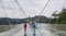 30th of May: Tourists walking and taking pictures in a rainy day at the Glass Bridge Grand Canyon, Wulingyuan, Zhangjiajie Nationa