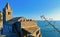 31.03.2019. San Pietro church with sea horizon in background, Lord Byron Natural park in Portovenere village on stone cliff rock a
