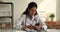 35s female physician doctor using smartphone in clinic.