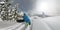 360, OVERCAPTURE, 3D: Young male hikes up a steep snowy mountain to snowboard.