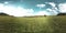 360 VR of a beautiful mountain meadow timelapse at the summer or autumn time. Clouds, green grass and sun rays.