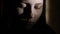 3Closeup portrait of a depressed teen girl in the dark. 4K UHD.