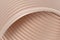 3D abstract background with a brown shade of peach cream, consisting of overlapping wavy ribbed surfaces