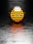 3d abstract metallic ribbed sphere with glowing orange centre on metallic flat floor with light behind