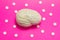 3D anatomical model of brain is on pink background surrounded by white pills as ornament polka dots. Medical concept by pharmacolo