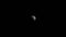 3d Animation of the Moon zooming in from a distance on black space.