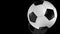 3D animation of realistic soccer ball rolling on mirror surface.