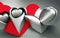 3D artistic silver metal heart shaped forms on red wrinkled cardboard and silver sandblast background, created with Generative AI