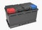 3D black truck battery with black handles and red and blue terminal covers on white