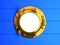 3d Brass porthole on blue wooden planking