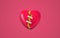 3D Broken Heart With Mend Plaster on red background. Yellow Heart inside the broken red heart as a hope of recovery