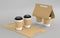 3D Coffee cups in kraft paper holders. Folding cardboard package for takeaway hot drinks. Realistic mockup of empty