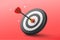 3d dart hit to center of dartboard with red background. minimal cartoon illustration.