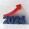 3D depiction of 2024 in bold blue numbers with upward red arrow symbolizing growth