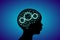 3d digital neuro blue glowing human brain with cog wheels on child head black silhouette