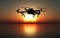 3D drone flying above a sunset sea