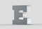 3D extruded uppercase letter E isolated on soft gray background.