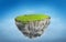 3D fantasy floating island with green grass land on blue sky