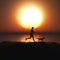 3D female jogging with her dog against a sunset sky