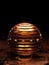 3d futuristic banded copper sphere in dark science fiction environment