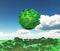 3D globe of trees over a grassy landscape