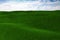 3d grass field and a perfect sky