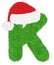 3D â€œGreen wool fur feather letterâ€ creative decorative with Red Christmas hat, Character K isolated in white background