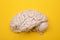 3D human brain model from external on yellow background