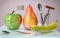 3d illustration of apple banana in glass and pear creative still life on glass table with spoon corkscrew picture in pink kitchen