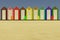 3d illustration of beach cabins with colorful chairs