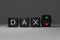 3d illustration of black dices with the word DAX on it, up and down arrows, conceptual image for stock exchange