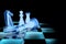 3D illustration chess pieces glowing neon on a black background