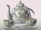 3d illustration of china checkered teakettle and tea cup on glass table in pink kitchen with day light imitation