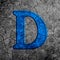 3d illustration cracked blue stone wall letter D on black grunge cement surface