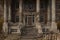 3D illustration of a creepy old mansion house entrance with human bones on the stone columns and steps