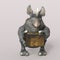 3D-illustration of a cute and funny cartoon kobold, presenting a gift, isolated rendering object