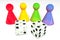 3d illustration: Four colored transparent plastic board game pieces with reflection and two white dice with black dots isolated on