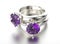 3D illustration gold ring with ultra violet gemstone. Jewelry ba