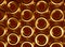 3d illustration of golden rings pattern background with metal gloss and reflections