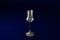 3D illustration of grappa glass on dark blue design background - drinking glass render