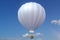 3D illustration hot air balloon on sky background. White, red, blue, green and yellow air ballon flyes on sky.