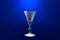 3D illustration of liqueur or vermouth glass on blue vivid background - drinking glass render