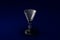 3D illustration of liqueur or vermouth glass on dark blue design background - drinking glass render