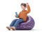 3D illustration of male guy Qadir in casual clothes sit in bag chair hold use mobile cell phone do winner gesture.