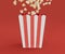 3D Illustration. Popcorn in red white striped bucket