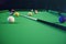 3D illustration recreation sport. Billiards balls with cue on green billiards table. Billiard sport concept. Pool