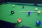 3D illustration recreation sport. Billiards balls with cue on green billiards table. Billiard sport concept. Pool