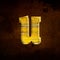 3D illustration shiny yellow iron letter u, rusty metal surfac