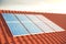 3D illustration solar panels on a red roff, power generation technology. Alternative energy. Solar battery panel modules