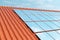 3D illustration solar panels on a red roof reflecting the cloudless blue sky. Energy and electricity. Alternative energy
